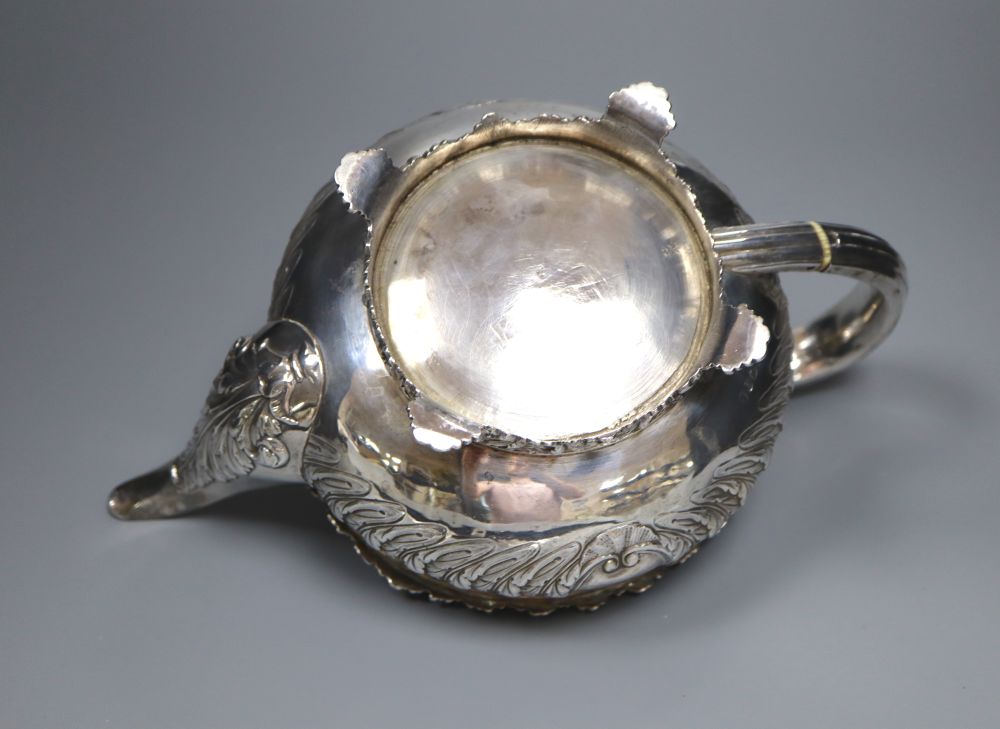 A George IV embossed silver squat circular teapot by Emes & Barnard, London, 1822,